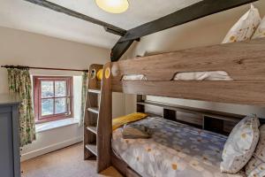 a couple of bunk beds in a room at 3 Bed in Pentre Bach oc-t30863 in Pentre-bâch