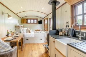 a kitchen and living room with a bed in the background at 1 Bed in Bronllys oc-t31949 in Bronllys