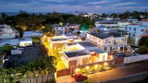 an aerial view of a city at night at Résidence Azélina 2 in Pointe aux Canonniers