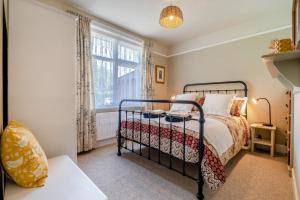 a bedroom with a bed and a window at 2 Bed in Dymchurch oc-s31998 in Dymchurch