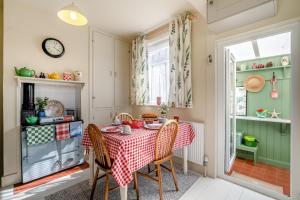 a dining room with a table and chairs at 2 Bed in Dymchurch oc-s31998 in Dymchurch