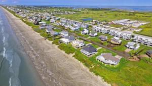 an aerial view of a resort on the beach at Shipwrecked Getaway For 6 in Galveston
