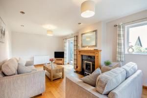 a living room with two couches and a fireplace at 2 Bed in Pickering oc-d32743 in Pickering