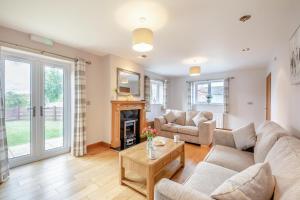 a living room with a couch and a fireplace at 2 Bed in Pickering oc-d32743 in Pickering