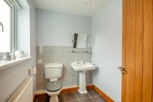 a bathroom with a toilet and a sink at 2 Bed in Pickering oc-d32743 in Pickering +16 photos