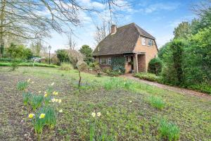 a house with a yard with flowers in front of it at 2 Bed in Charing oc-r29113 in Charing