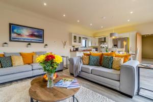 a living room with a couch and a table at 3 Bed in Heveningham oc-w29031 in Heveningham
