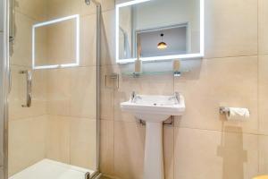 a bathroom with a sink and a shower with a mirror at 3 Bed in Heveningham oc-w29031 in Heveningham +27 photos