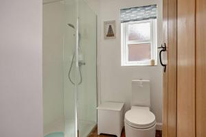a bathroom with a shower and a toilet at 2 Bed in Dersingham oc-b27417 in Dersingham +14 photos