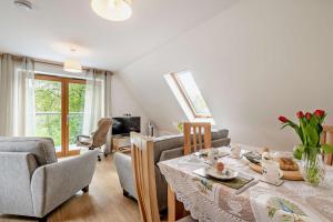 a living room with a dining room table and chairs at 2 Bed in Eccles oc-l27507 in Eccles