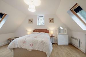 a bedroom with a bed with a white comforter at 2 Bed in Eccles oc-l27507 in Eccles