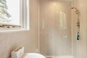 a bathroom with a shower with a toilet and a sink at 2 Bed in Eccles oc-l27507 in Eccles +9 photos