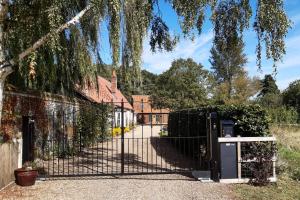 an iron gate in front of a house at 2 Bed in Eccles oc-l27507 in Eccles