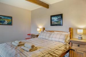 a bedroom with a bed with towels on it at 2 Bed in Eggleston oc-s30453 in Middleton in Teesdale