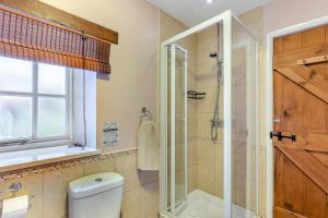 a bathroom with a toilet and a glass shower at 2 Bed in Eggleston oc-s30453 in Middleton in Teesdale +19 photos