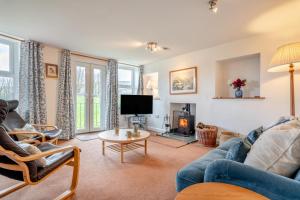 a living room with a couch and a tv at 2 Bed in Hawes oc-ds1041 in Hawes