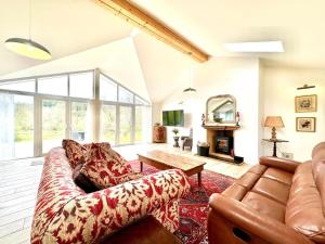 a living room with a couch and a table at 2 Bed in Witheridge oc-b29206 in Witheridge