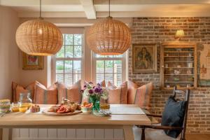 a dining room with a table and chairs and lights at 3 Bed in Wittersham oc-m27683 in Wittersham
