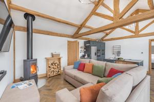 a living room with a couch and a wood stove at 2 Bed in Allendale oc-r29078 in Allendale Town