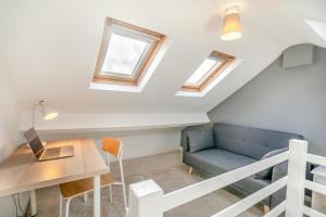 a room with a table and a couch and a laptop at 2 Bed in Pooley Bridge oc-l31060 in Pooley Bridge +21 photos