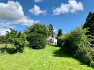 a house with a yard with trees and grass at 2 Bed in Pooley Bridge oc-l31060 in Pooley Bridge