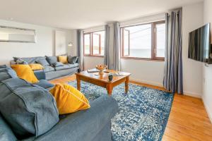 a living room with a couch and a table at 3 Bed in Coverack oc-b31082 in Coverack