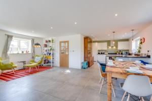 a kitchen and living room with a table and chairs at 3 Bed in Chatton oc-nb1987 in Chatton