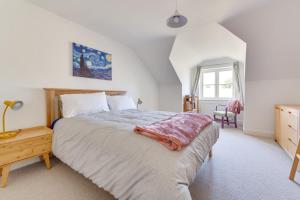 a bedroom with a large bed and a window at 3 Bed in Chatton oc-nb1987 in Chatton