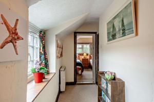 a hallway with a room with a starfish on the wall at 2 Bed in Brancaster oc-b28394 in Brancaster