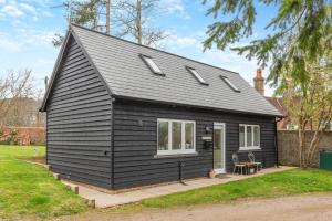 a black house with a pitched roof at 2 Bed in Battle oc-m31780 in Battle