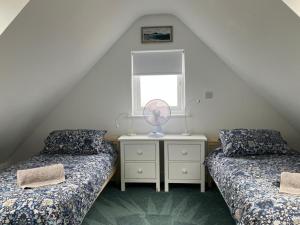 a bedroom with two beds and a mirror and a window at 2 Bed in Battle oc-m31780 in Battle