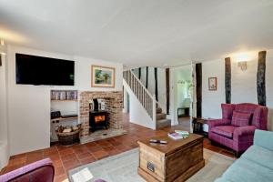 a living room with a couch and a fireplace at 2 Bed in Ilketshall St. Margaret oc-w27520 in Rumburgh