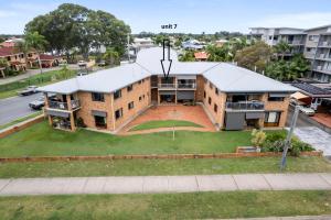 an aerial view of a house with a yard at Crystal Waters-2 bed, 2 bathroom, Beachfront Unit! in Bongaree +17 photos