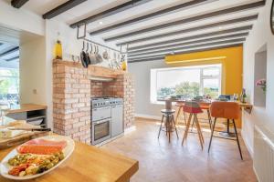 a kitchen with a table with a plate of food on it at 3 Bed in Llysfaen oc-t32226 in Llysfaen