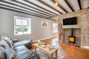 a living room with a couch and a fireplace at 3 Bed in Llysfaen oc-t32226 in Llysfaen