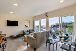 a living room with a table and chairs and a tv at 2 Bed in Aberdovey oc-n30627 in Aberdyfi