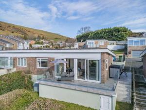 a view of a house with a glass extension at 2 Bed in Aberdovey oc-n30627 in Aberdyfi