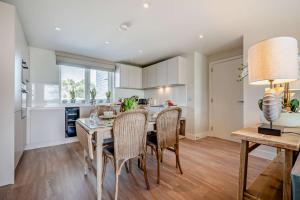 a kitchen and dining room with a table and chairs at 2 Bed in Padstow oc-h29015 in Padstow