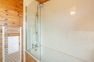 a bathroom with a shower with a glass door at 2 Bed in Otley oc-slm in Burgh +9 photos