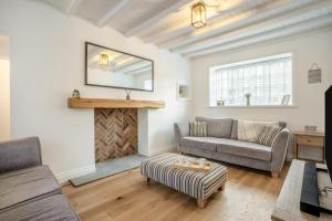 a living room with a couch and a fireplace at 3 Bed in Pickering oc-t33630 in Pickering