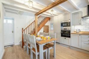 a kitchen and dining room with a table and chairs at 3 Bed in Pickering oc-t33630 in Pickering +18 photos