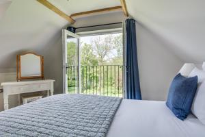 a bedroom with a bed and a sliding glass door at 1 Bed in Wadhurst oc-tw668 in Ticehurst