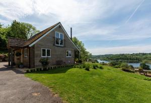 a house on a hill with a view of a river at 1 Bed in Wadhurst oc-tw668 in Ticehurst