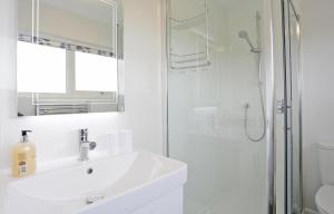 a white bathroom with a sink and a shower at 3 Bed in Aldeburgh oc-10nw in Aldeburgh +10 photos