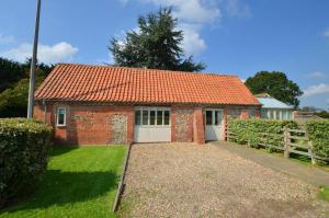 a small brick house with an orange roof at 2 Bed in Briston oc-1551 in Briston