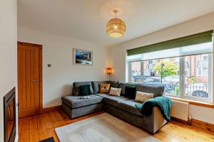 a living room with a couch and a large window at 3 Bed in North Shields oc-b29939 in Tynemouth