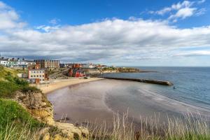 a view of a beach with buildings and the ocean at 3 Bed in North Shields oc-b29939 in Tynemouth