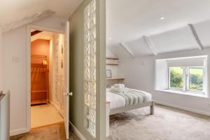 a bedroom with a bed and a window at 5 Bed in Bodmin oc-l29658 in Blisland