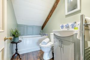 a bathroom with a toilet and a sink and a tub at 4 Bed in Alnmouth oc-a30221 in Alnmouth +19 photos