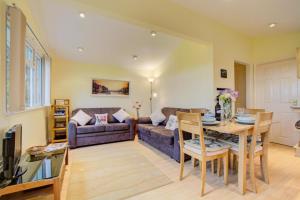 a living room with a couch and a table at 2 Bed in St. Merryn oc-p00673 in Saint Merryn